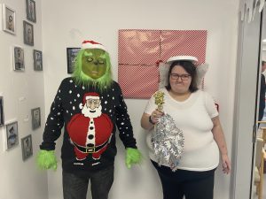 Service Users dressed as Grinch and an Angel