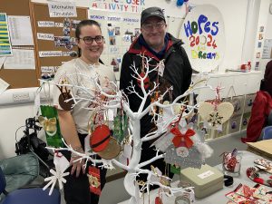 Service User and staff selling Crafts at the Fresh Focus Winter Wonderland