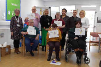 Service Users with their certificates for completing the Safer Eating and Drinking Programme with staff