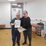 Service User receives their certificate for completing the Safer Eating and Drinking Programme from Janice McAllister