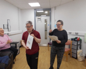 Service User receives their certificate for completing the Safer Eating and Drinking Programme from Janice McAllister