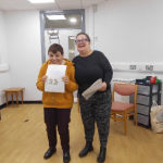 Service User receives their certificate for completing the Safer Eating and Drinking Programme from Janice McAllister