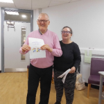 Service User receives their certificate for completing the Safer Eating and Drinking Programme from Janice McAllister