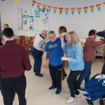 Staff and Service Users dancing at the Easter Party