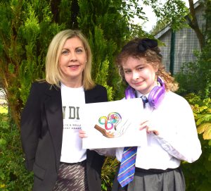 15-18 Age Category Winner Caoimhe McNamee presented their prize by Margaret Ferris