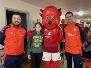 Clara Logue With MUFC Foundation Team