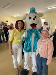 Staff and child with the Easter Bunny