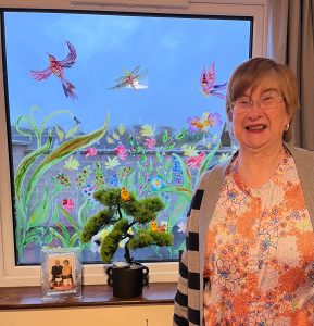 Creamery House Service User with their window painting