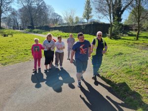 Service Users and staff enjoying a walk in the good weather
