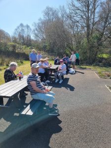 Service Users and staff enjoying a walk in the good weather