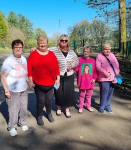Service Users and staff enjoying a walk in the good weather