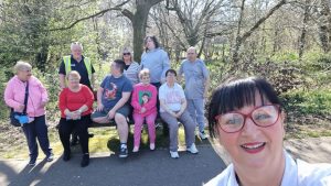 Service Users and staff enjoying a walk in the good weather