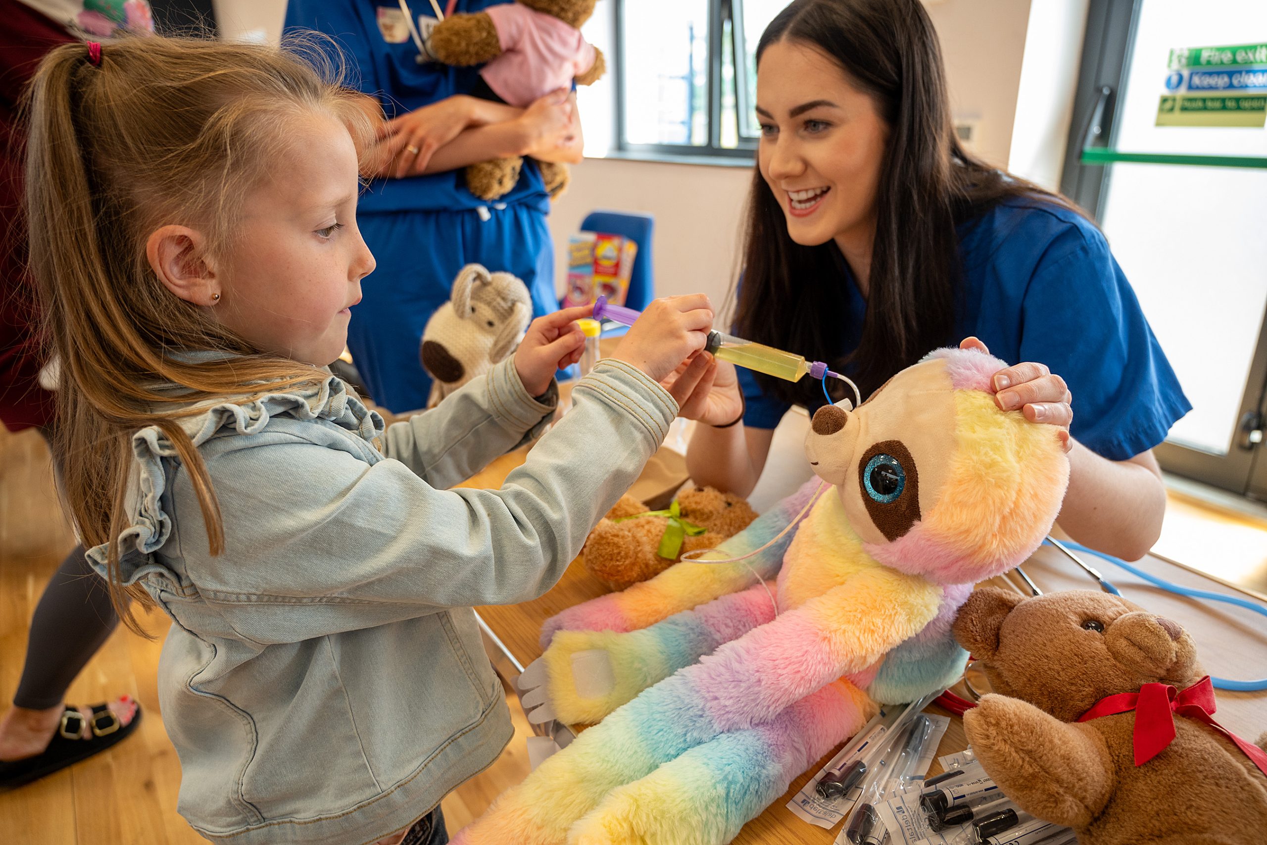Medical students from the Child Health Society at Ulster University’s Magee College campus put on their scrubs in the Waterside Shared Village as they hosted a Teddy Bear Hospital for children. Families from Altnagelvin Parents Group came together as children grabbed their stethoscopes, x-ray machines and other medical equipment check on the health of their teddys. Medical Student Charolett Henry with Vivian Wright
