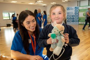 Medical students from the Child Health Society at Ulster University’s Magee College campus put on their scrubs in the Waterside Shared Village as they hosted a Teddy Bear Hospital for children. Families from Altnagelvin Parents Group came together as children grabbed their stethoscopes, x-ray machines and other medical equipment check on the health of their teddys. Student Jasmine Gallagher helps Sophie Wilson with her teddy's oxygen supply