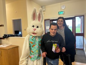 Service User and staff with the Easter Bunny