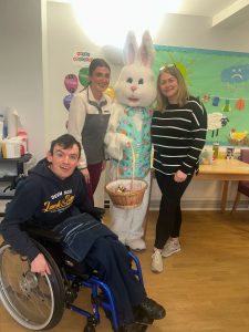 Service User and staff with the Easter Bunny