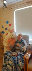 Service User with the Easter Bunny at Tir Navar Day Centre