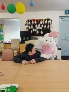 Service User with the Easter Bunny at Tir Navar Day Centre