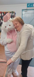 Service User with the Easter Bunny at Tir Navar Day Centre