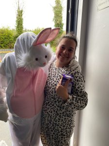 Service User with the Easter Bunny at Tir Navar Day Centre