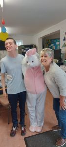 Service User and staff member with the Easter Bunny at Tir Navar Day Centre
