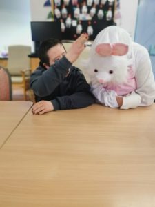 Service User with the Easter Bunny at Tir Navar Day Centre