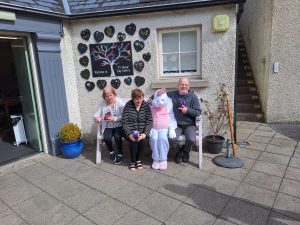 Service users and Staff enjoying the Sun at Tir Navar