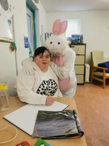 Service User with the Easter Bunny at Tir Navar Day Centre