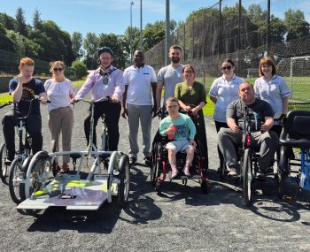 Representatives from the Trust, Fermanagh Omagh District Council and Mulhern Close (Inspire Wellbeing) with service users and carers at the launch of the inclusive bikes