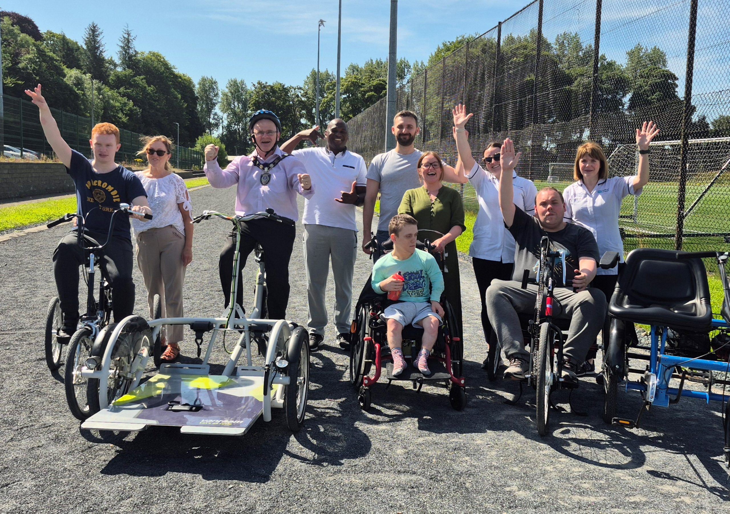 Representatives from the Trust, Fermanagh Omagh District Council and Mulhern Close (Inspire Wellbeing) with service users and carers at the launch of the inclusive bikes