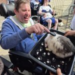 Service User enjoying the visit from Kidz Farm