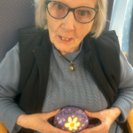 Caroline Martin with her painted rock at Thackeray Day Centre
