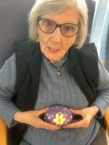 Caroline Martin with her painted rock at Thackeray Day Centre