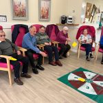 Service Users Enjoying Chair Based Activities At Tempo Road Day Centre