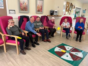 Service Users Enjoying Chair Based Activities At Tempo Road Day Centre