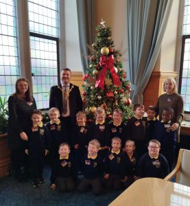 'Sinead Marlow and Karen McGlinchey, Speech and Language Therapists in WHSCT, pictured with staff and children from Ebrington Speech and Language Class, visited the Mayor in the Guildhall today to help raise awareness of Developmental Language Disorder (DLD).