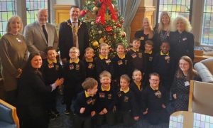 'Sinead Marlow and Karen McGlinchey, Speech and Language Therapists in WHSCT, pictured with staff and children from Ebrington Speech and Language Class, visited the Mayor in the Guildhall today to help raise awareness of Developmental Language Disorder (DLD).