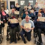 Drumcoo Day Centre Service Users with their certificates for completing the Living Life to the Full Course