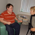 Service User At Glenside ATC With Their Carer At The Halloween Disco