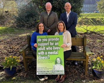 Pictured promoting Information Events for carers and families who provide support to an adult living with a mental illness standing from left to right: Roger Johnston, Service Manager Supported Living/Professional Social Worker (interim) Adult Mental Health Team and Brian Toner, Service User Consultant for Adult Mental Health Services at the Western Trust. Seated from left to right: Gabrielle McAloon, Carers Supporter Worker and Geraldine McLaughlin, Carers Co-ordinator, Western Trust.