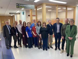 A picture showing staff members and relatives at the newly refurbished ICU relatives rooms at SWAH