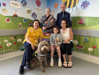 Karrine and Neil Doherty with their daughter Clodagh pictured at the Children’s Ward, Altnagelvin Hospital along with Mia the assistance dog along with Cathy Grady, Play Specialist Nurse, Altnagelvin Hospital and Geraldine McGaughey, Chief Executive Officer and Founder of ADNI .