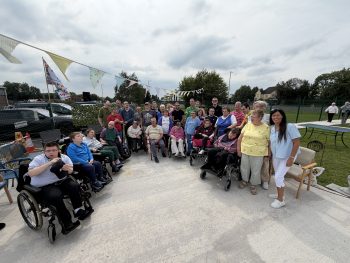 Killadeas Day Centre service users and staff at the opening garden party in garden setting