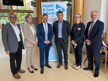 Health Minister Robbie Butler posing for a photograph and meeting with staff at South West Acute hosptial