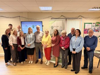 a picture of staff from the Western Trust meeting with staff and volunteers from the Oak Healthy Living Centre