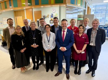 Large group of Western Trust staff alongside Health Minister
