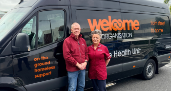 Bill Higgins, Driver for Welcome Organisation Mobile Health Unit and Michelle Doyle, Public Health Nurse for the homeless at the Western Trust standing in front of Welcome Organisation Mobile Health Unit
